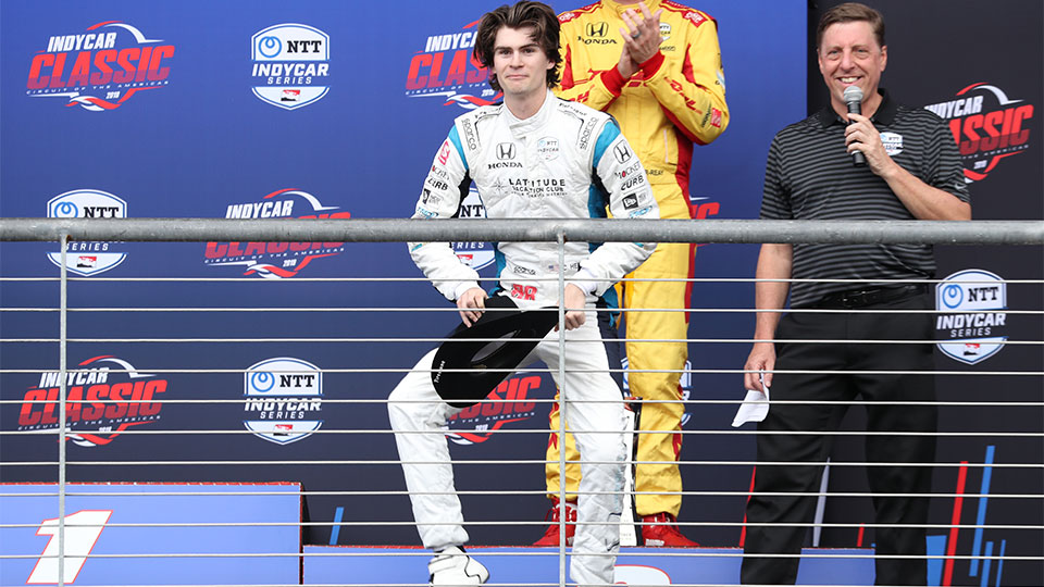 Colton Herta dances on the podium at the Circuit of the Americas