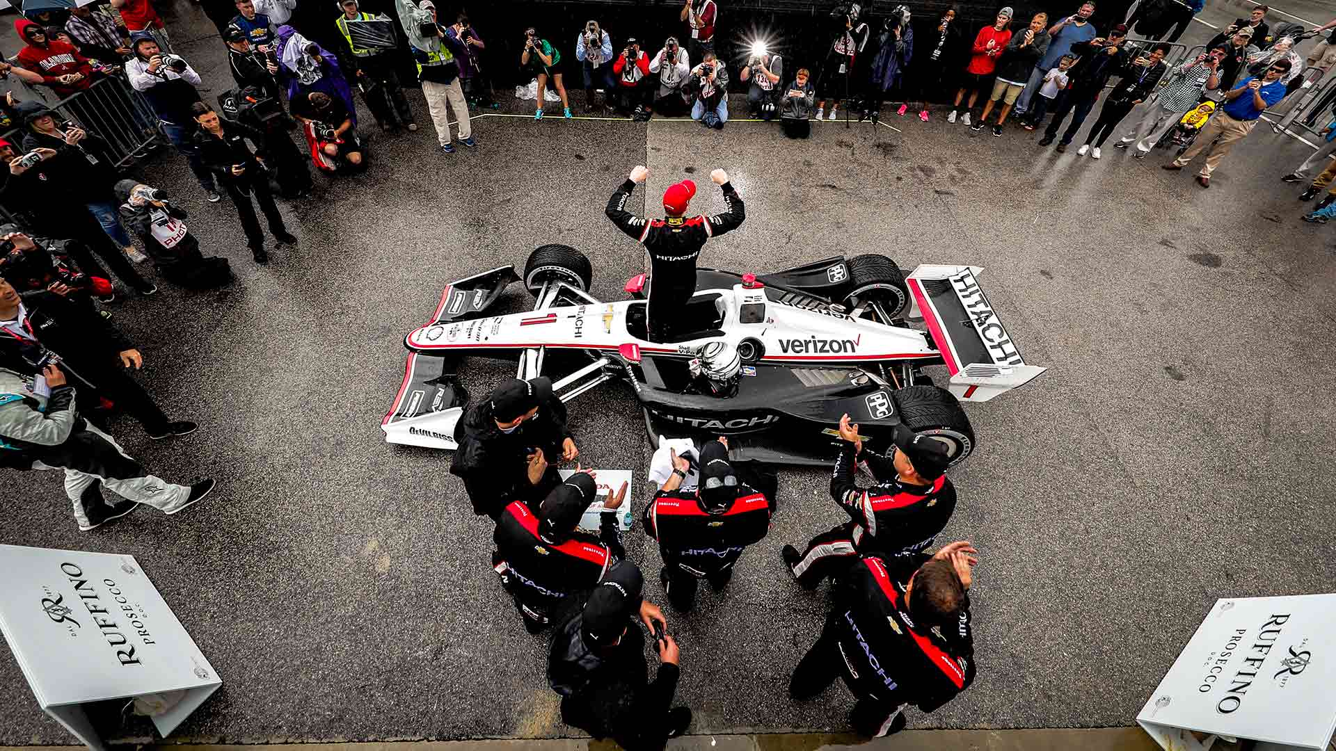 Overhead shot of Josef Newgarden exiting his car in Victory Circle